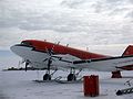 A ski equipped Basler BT-67 operated by Kenn Borek Air for the United States Antarctic Program at Williams Field during the 2006-2007 season. The rear landing gear has been temporarily removed from the aircraft for repair