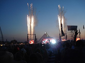 Beyonce's 4 saw four weeks at the top of the chart, following her performance at the 2011 Glastonbury Festival (pictured), which gained record TV viewing figures of 2.6 million in the UK. Beyonce's Arrival glastonbury 2011.jpg