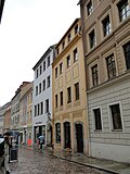 Residential house in closed development and side wing in the courtyard