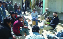 Civil Affairs officer speaking with local inhabitants during Operation Enduring Freedom, in Afghanistan. Captain Jokinen in Afghanistan.jpg