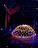 A phoenix-shaped decoration and the caldron bearing the Olympic flame