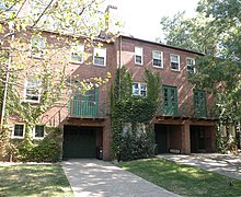 View of the back of some homes (with deeply recessed garages) fronting on the street ChathamVillage2.jpg