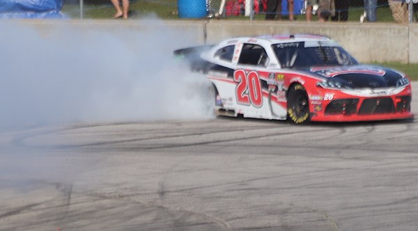 Christopher Bell does a burnout after winning the race