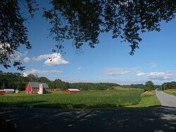 Much of Drammen is farms in the valleys between wooded hills.