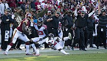 Kazee catching an interception against the Washington Redskins in 2018. Damontae Kazee (30781990087).jpg