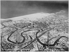 The Cuyahoga River winds through the Flats in a December 1937 aerial view of Downtown Cleveland. Downtown Cleveland, Ohio, in winter, from the air, 12-1937 - NARA - 512842.jpg