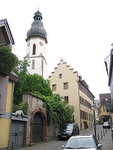 Former town hospital, founded 1259 (back entrance) and bell tower of St. George's Church in the background Georgenspital03.JPG