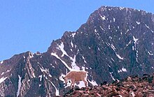 A mountain goat below Granite Peak Granite Peak Montana.jpg