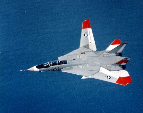 A Grumman F-14 Tomcat testing an unusual asymmetric wing configuration, a possible in-flight failure case, showing one wing at minimum sweep and one a
