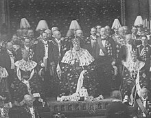 King Oscar II of Sweden, his crown prince Gustaf (V) and grandson Gustaf (VI) Adolf in their crowns and coronets on a state occasion about 1900. Gustaf (V), Oscar II & Gustaf (VI) Adolf open Parliament.jpg
