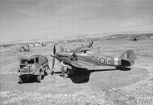 Hurricane Mark IV, KZ188 ?C?, of No. 6 Squadron RAF being refuelled, amid other aircraft of the Squadron, on a dispersal at Prkos, Yugoslavia.