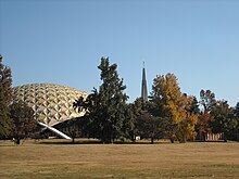 Howard Auditorium and the Prayer Tower (the gas flame at the top of the tower is barely visible in this photograph) Howard Prayer Tower.jpg