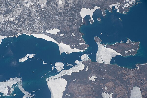 Emmet County is at the lower center-left, Cheboygan County is at the lower right, and Mackinac County is above both of them; taken April 10, 2022, fro