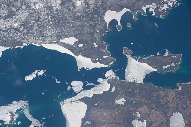 Emmet County is at the lower center-left, Cheboygan County is at the lower right, and Mackinac County is above both of them; taken April 10, 2022, fro