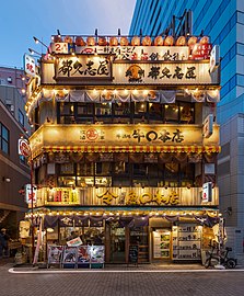 Illuminated facade of a 3-storey restaurant, Tokyo