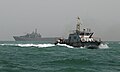 An Iraqi patrol boat in front of USS Resolution, LST 208.