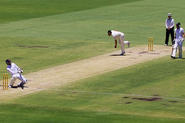 Graeme Swann evades a bouncer from Mitchell Johnson