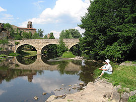 The medevieval village, the old bridge on the Senouire River and the St. André abbey.