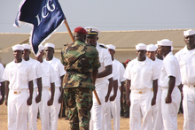 Major General Suraj Abdurrahman, Command Officer-in-Charge of the AFL, hands over a new Guidon to the reactivated Coast Guard. Liberian Coast Guard formation.png