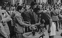 King Faisal II awards medals to Al-Minaa captain Allawi after Al-Minaa won the King Cup in 1948.