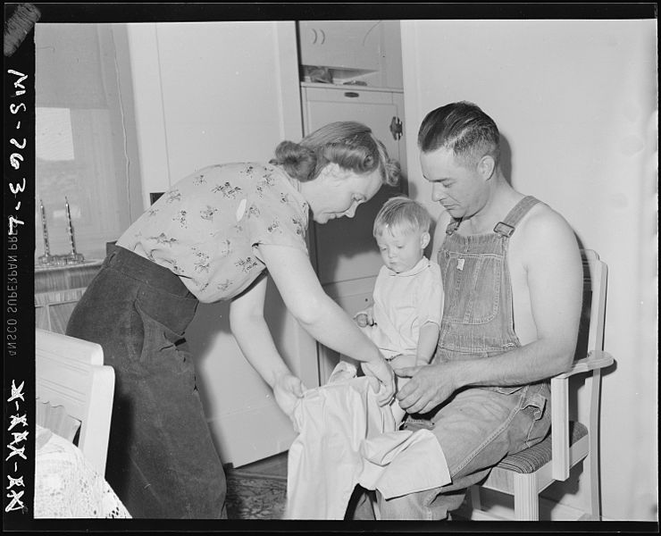 File:Mr. and Mrs. Thomas Overy change clothes on their baby. Union Pacific Coal Company, Stansbury Mine, Rock Springs... - NARA - 540587.jpg