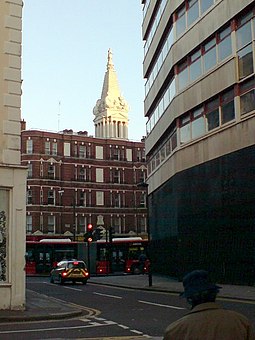 Looking north along Museum Street, towards New Oxford Street, with the steeple of St George's Church, Bloomsbury in the background. Museum Street and New Oxford Street, Bloomsbury - geograph.org.uk - 603654.jpg