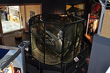 Top tier of the 1881 optic on display at the National Maritime Museum; as of 2021 the identical lower tier remains in use in the lighthouse. National Maritime Museum Cornwall (8826).jpg