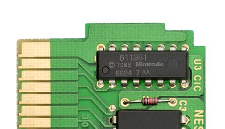 The 10NES authentication chip (at top) contributed to the system's reliability problems. The circuit was ultimately removed from the remodeled New-Style NES.