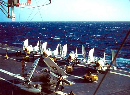 4 FJ-3 Fury fighter-bombers of VF-33 and an AD-6 of VA-25 on the deck of USS Intrepid in the North Atlantic in 1957