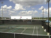 The tennis courts at Riverside High in 2010. The stadium is in the background with the current Riverside logo. RHS tennis courts - SC.jpg