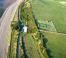 Milefortlet 21 at Crosscanonby on the Cumbrian coast, with later, 18th-century, saltpans across the road to the left Roman Milefortlet and Saltpans of Crosscanonby, Solway Coast, Cumbria - geograph.org.uk - 53621.jpg