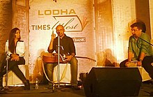 Shreya Ghoshal (left) reading and singing Shantanu Moitra's memoirs at Times Litfest event along with Swanand Kirkire (right) on 6 December 2014. The song is composed by Moitra, sung by Ghoshal and written by Kirkire. Shreya at Times Litfest.jpg