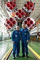 Soyuz MS-04 crew in front of their booster rocket.jpg