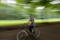 Speed in Amsterdam Cyclist speeding past in a great park Amsterdamse Bos - panoramio.jpg