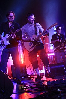 Dan Nelson, Rick Anderson, and Jeff Hubbard performing in 2012. Swim Herschel Swim guitarists.jpg