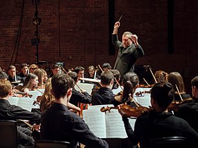 Thomas Adès conducts the National Youth Orchestra of Great Britain at Snape Maltings Concert Hall.jpg