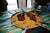 Omani food is heavily influenced by Indian cuisine, and is generally centered on richly-seasoned chicken, fish, and lamb, as well as rice.