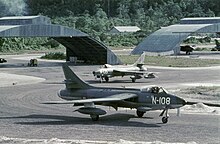 A pair of Dutch Hunter F.4 aircraft operating out of Mokmer airport in New Guinea, 1962. Twee Hawker Hunters F.Mk.4 op de taxitrack Mokmer voor aanvang van de officiele afscheidsvlucht (2157 016447).jpg