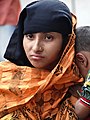 Woman outside Shrine of Hazrat Shah Jalal - Sylhet - Bangladesh (12988233694).jpg