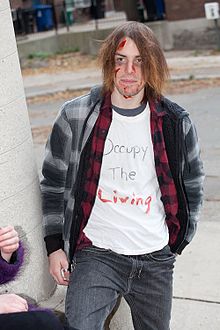 A zombie wearing a 'mock' political shirt during a Zombie Walk in Toronto, 2011 Zombie Walk Toronto 2011.jpg