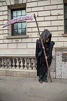 Protestor dressed as the Grim Reaper in Whitehall. Image: John Lubbock (flickr).