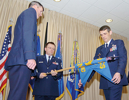 Air Force personnel case a squadron guidon as part of an inactivation ceremony.