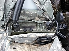 AN/PRC 113 radio using the RT-1319 transceiver with the H-250 Handmic in a UCP MOLLE II assault pack and radio pouch. AN PRC 113.jpg