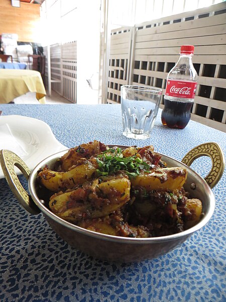 File:ASC Leiden - Rwanda 2021 - 085 - Hot food in a two-eared dish on a tablecloth in a dining room - Kigali.jpg