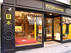 A shop in France selling westernized futons with frames