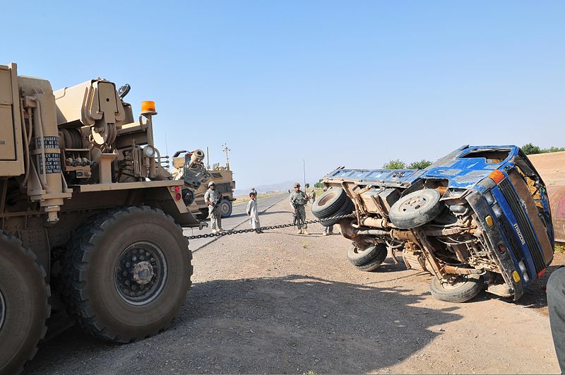 File:A heavy expanded mobility tactical truck assigned to the U.S. Army pulls a pickup truck of its side after a convoy resupply mission in southwestern Afghanistan July 6, 2011 110706-A-UB106-244.jpg