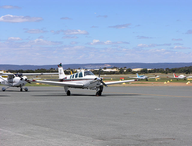 Light aircraft at Jandakot Airport, with the Darling Range in the distance.