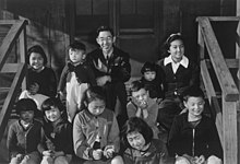 Manzanar Children's Village superintendent Harry Matsumoto with several orphan children. ("Mr. Matsumoto and group of children" by Ansel Adams, courtesy of Library of Congress Prints & Photographs Division, LC-DIG-ppprs-00362) Ansel Adams Manzanar - Children's Village - LC-DIG-ppprs-00362.jpg