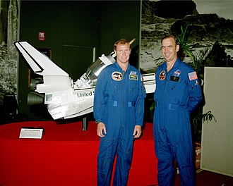 Astronauts John M. Fabian and David M. Walker pose in front of a model of the Shuttle-Centaur with Galileo in mid-1985 Astronauts John Fabian and Dave Walker pose in front of a model of the Shuttle-Centaur.jpg