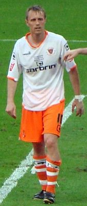 Brett Ormerod (pictured in 2010) scored four times in the play-off semi-finals and once in the final. Brett Ormerod.jpg